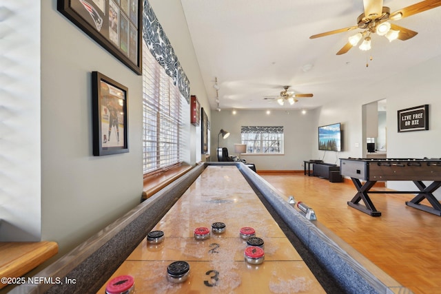 recreation room featuring parquet floors