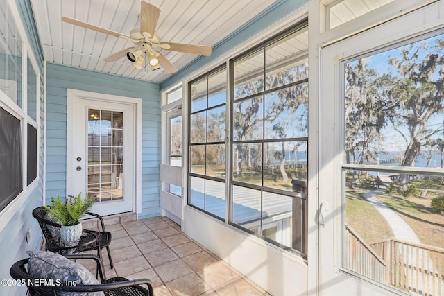 sunroom / solarium with ceiling fan