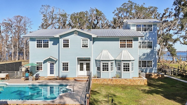 back of house with a lawn