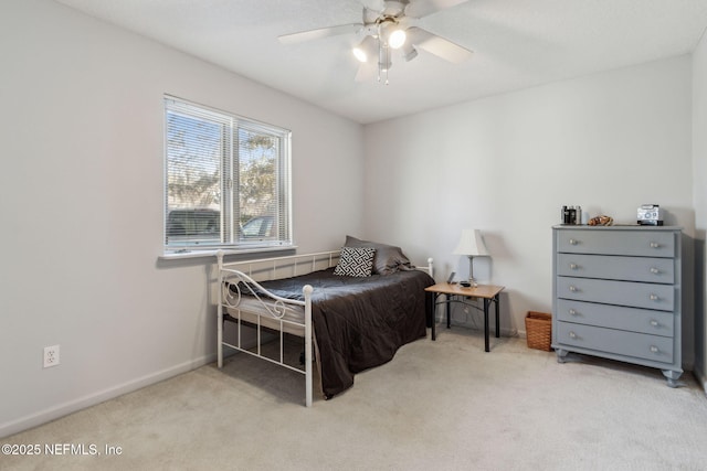 bedroom with light colored carpet and ceiling fan