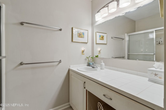 bathroom with vanity and walk in shower