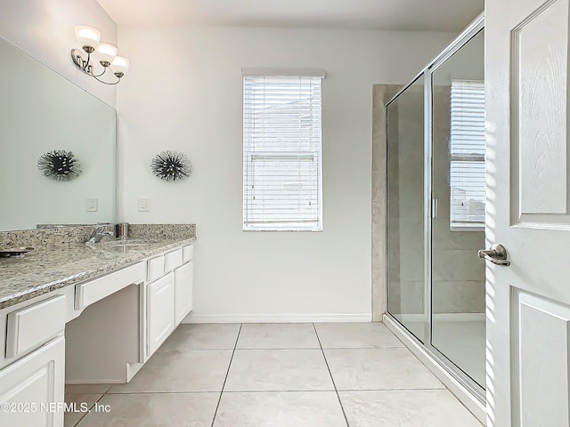 bathroom with vanity, tile patterned floors, and walk in shower