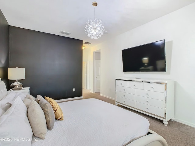 carpeted bedroom featuring a chandelier