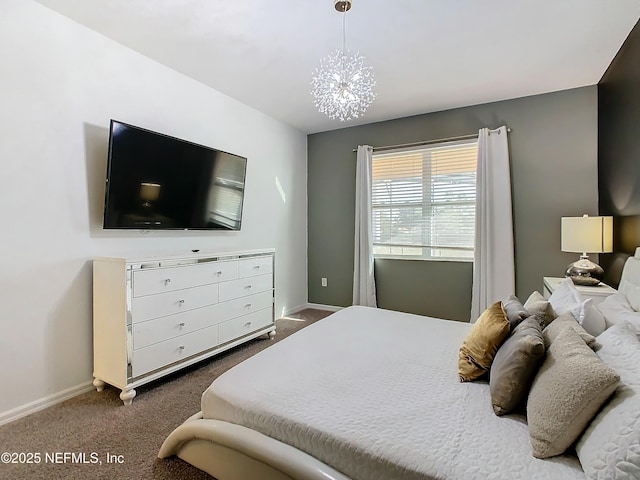 bedroom with an inviting chandelier and dark colored carpet