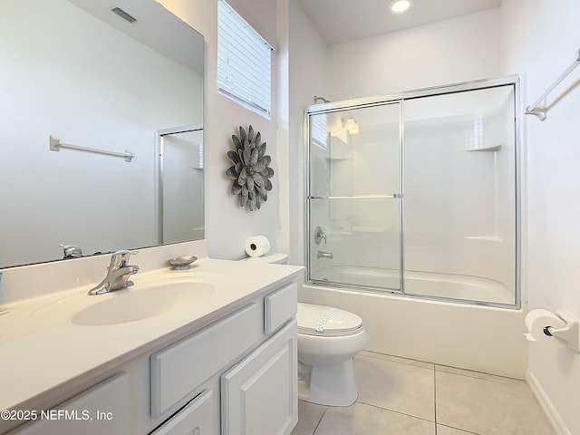 full bathroom with tile patterned flooring, vanity, toilet, and enclosed tub / shower combo