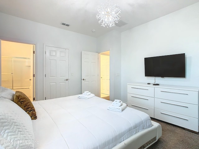 carpeted bedroom with a notable chandelier