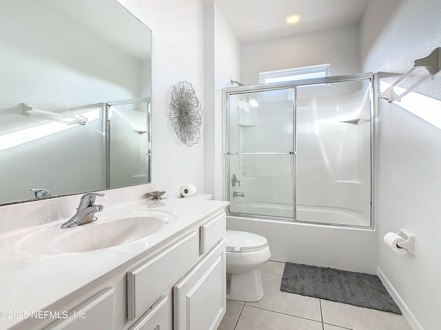 full bathroom featuring tile patterned flooring, vanity, toilet, and enclosed tub / shower combo