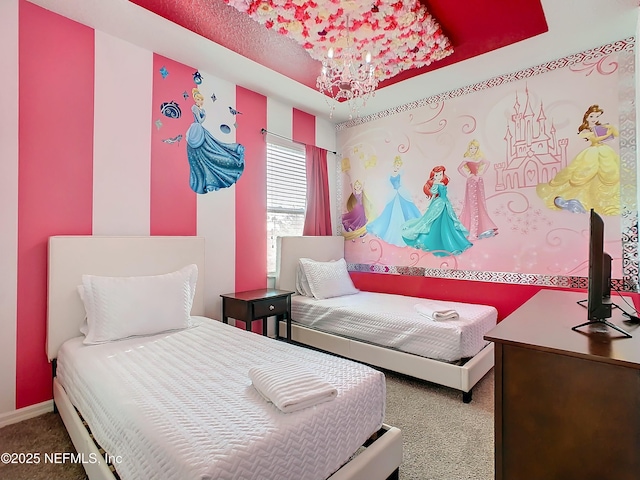 carpeted bedroom featuring an inviting chandelier