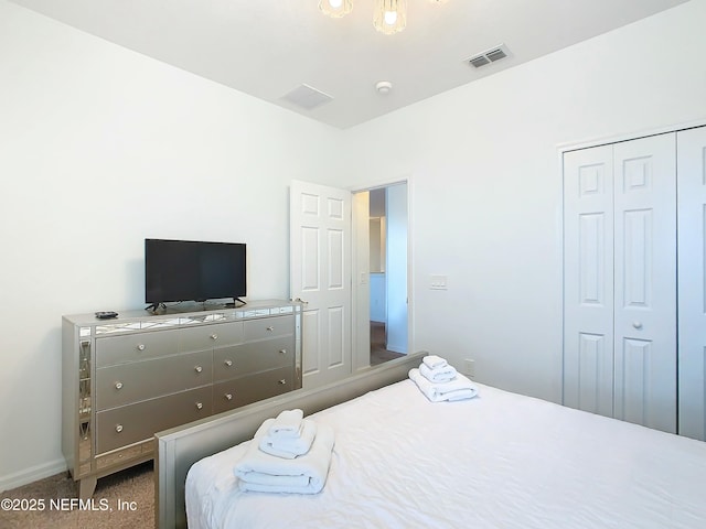 carpeted bedroom featuring a closet