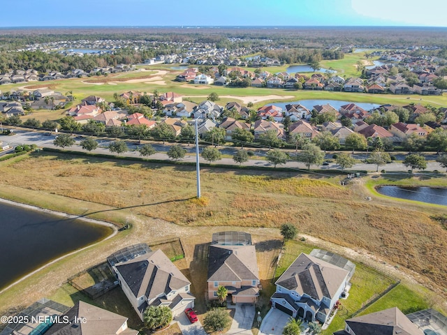 drone / aerial view with a water view