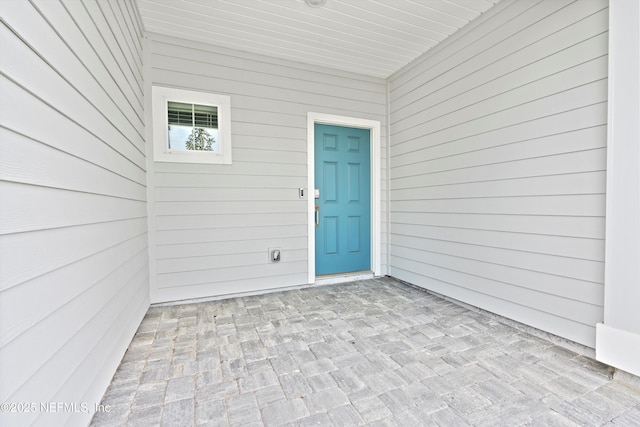 doorway to property featuring a patio area