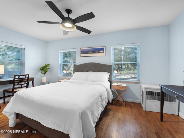 bedroom featuring hardwood / wood-style flooring and ceiling fan