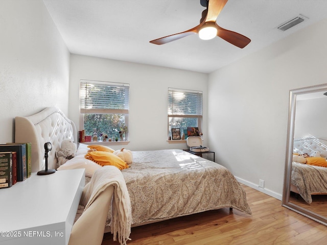 bedroom featuring ceiling fan and light hardwood / wood-style flooring