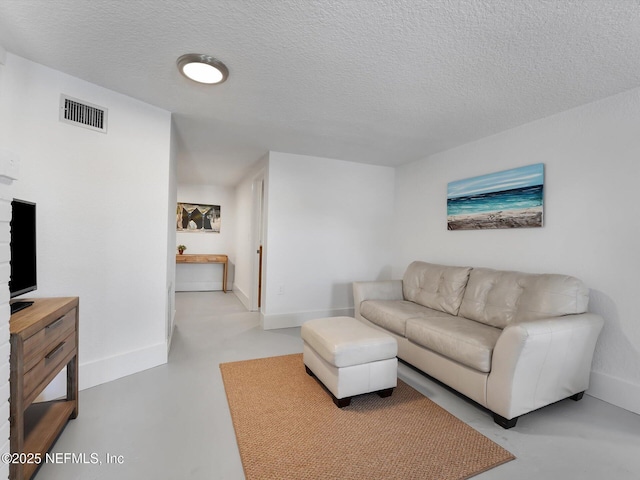 living room with a textured ceiling