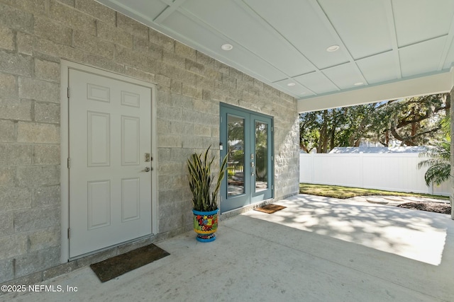 doorway to property with a patio area and french doors