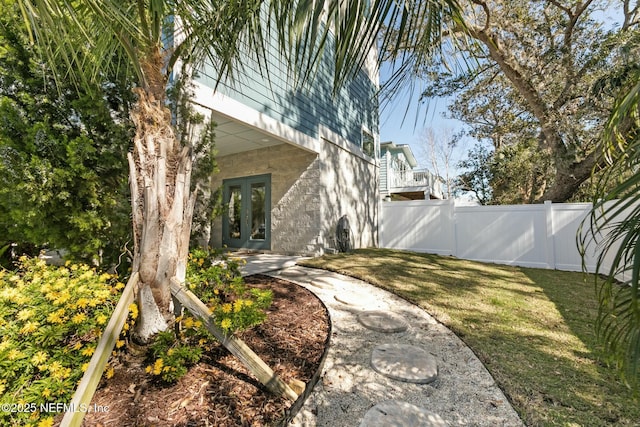 view of yard featuring french doors