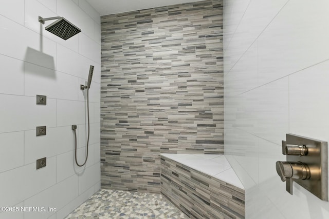 bathroom with tiled shower