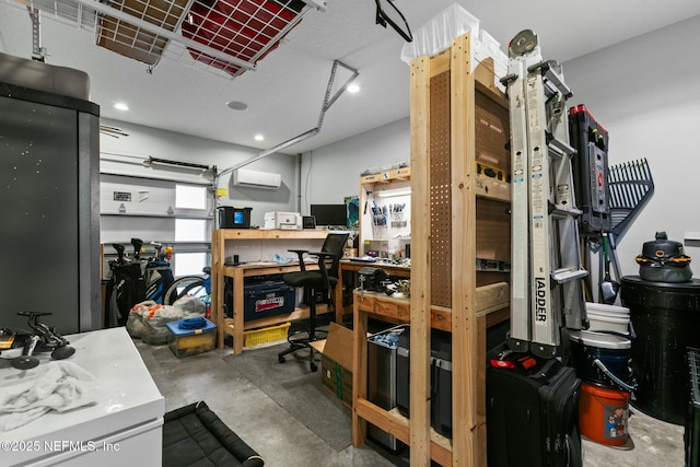 storage room with a garage and a wall mounted AC