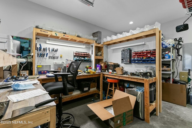 interior space featuring concrete floors and a workshop area