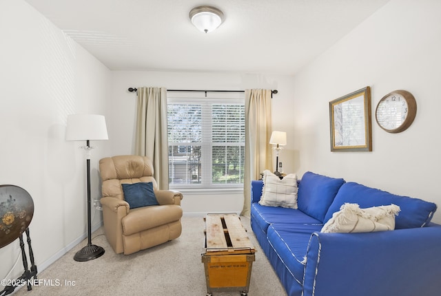 living room with carpet and baseboards