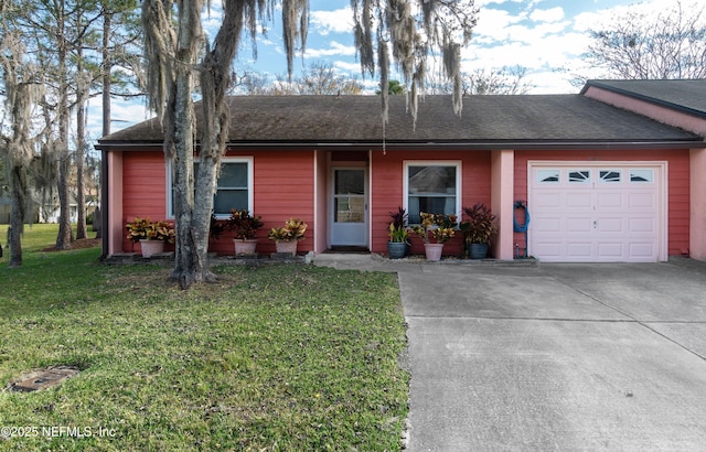 ranch-style house featuring a garage and a front lawn