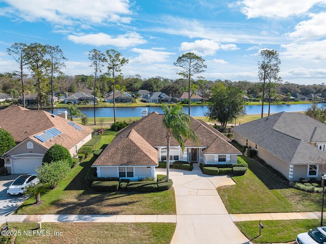 drone / aerial view with a water view