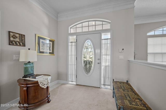 foyer featuring light colored carpet and ornamental molding