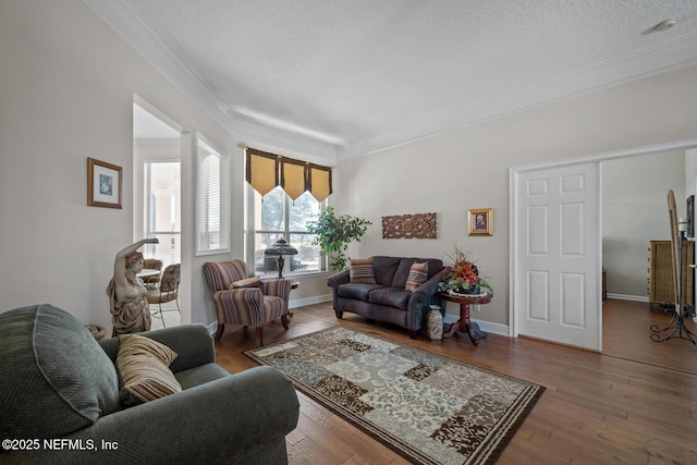 living room with a textured ceiling, dark hardwood / wood-style floors, and crown molding