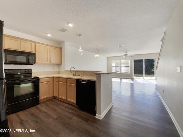 kitchen featuring kitchen peninsula, dark wood-type flooring, sink, black appliances, and light brown cabinets