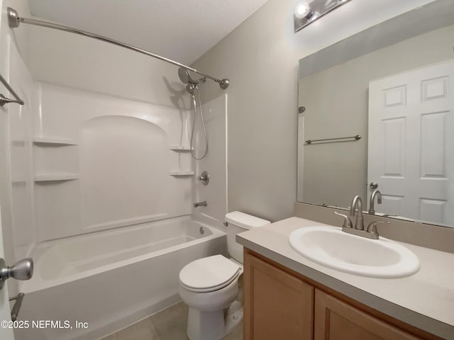 full bathroom featuring tile patterned floors, toilet, vanity, and washtub / shower combination