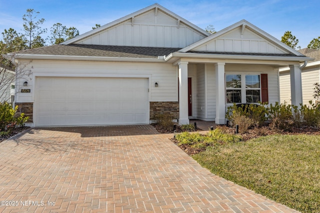 view of front of home featuring a garage and a front lawn