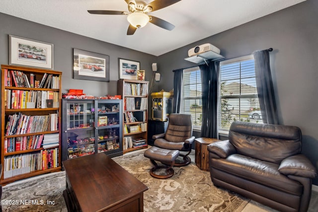 sitting room with ceiling fan