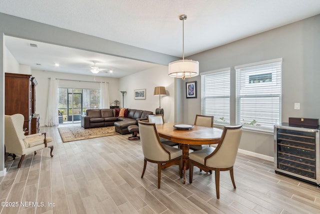 dining area featuring wine cooler