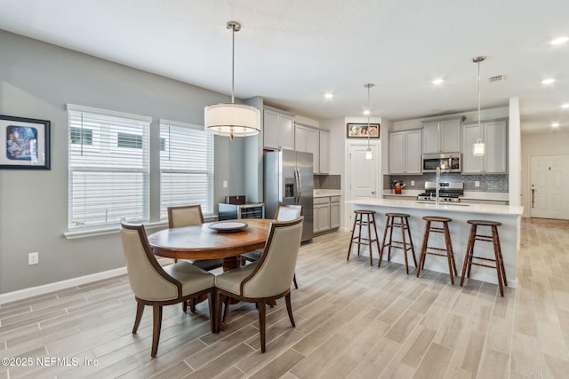 dining area featuring sink