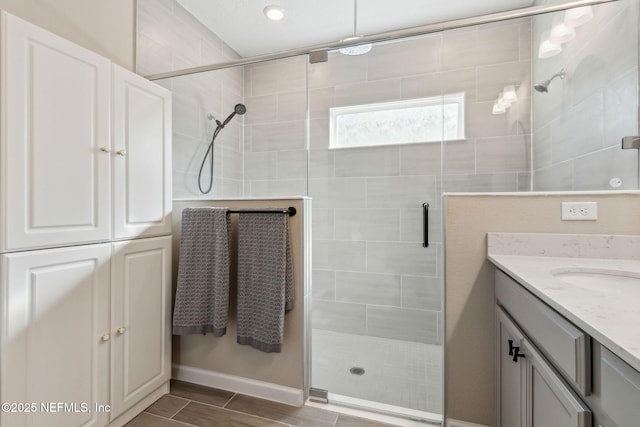 bathroom with vanity and an enclosed shower