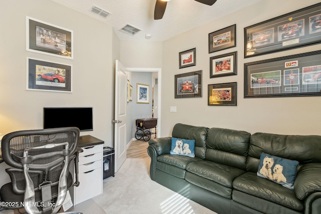 carpeted office with ceiling fan