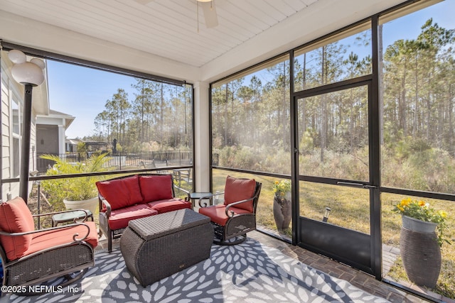 sunroom / solarium with ceiling fan