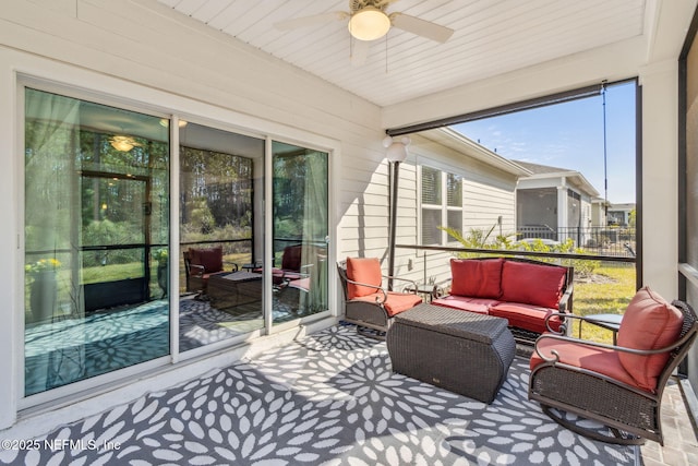 sunroom / solarium with ceiling fan