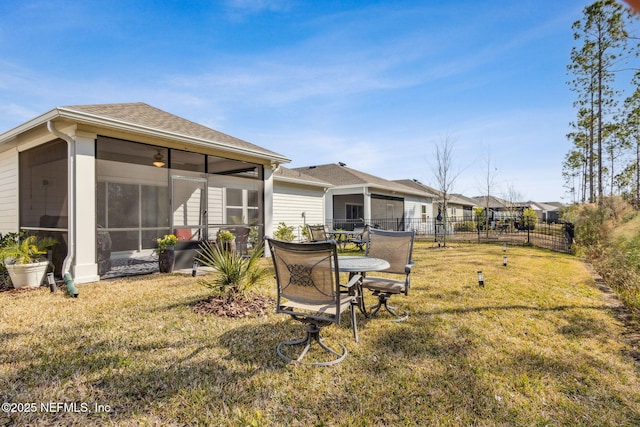 view of yard with a sunroom