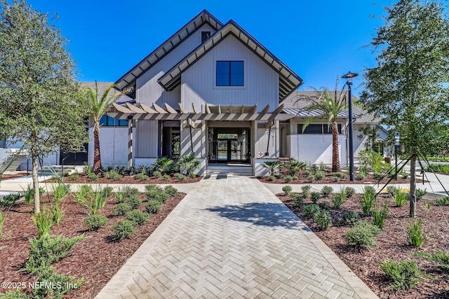 modern inspired farmhouse featuring covered porch