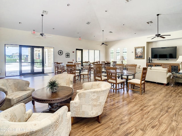 living room with ceiling fan and light hardwood / wood-style floors