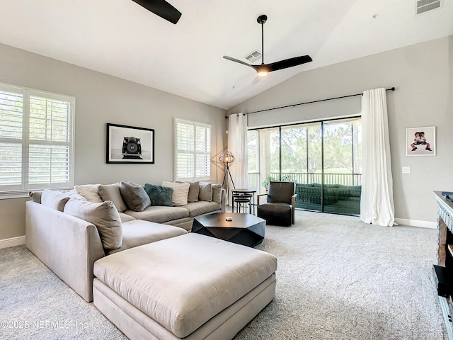 living room with light carpet, vaulted ceiling, and ceiling fan