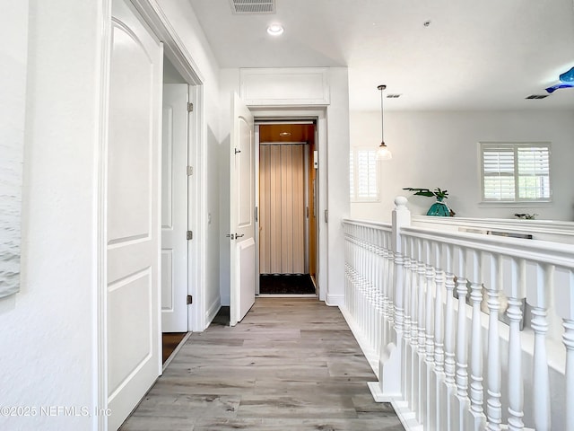 corridor featuring light wood-type flooring