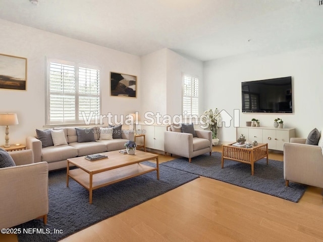 112 Laterra Links Cir Unit 201, Saint Augustine, FL 32092 - living area with wood finished floors and healthy amount of natural light