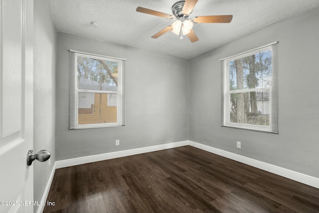 spare room with ceiling fan, dark hardwood / wood-style flooring, and a textured ceiling