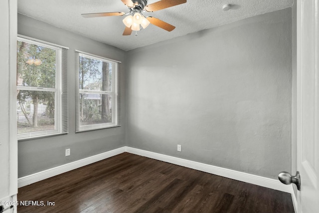 empty room featuring hardwood / wood-style flooring, ceiling fan, and a textured ceiling