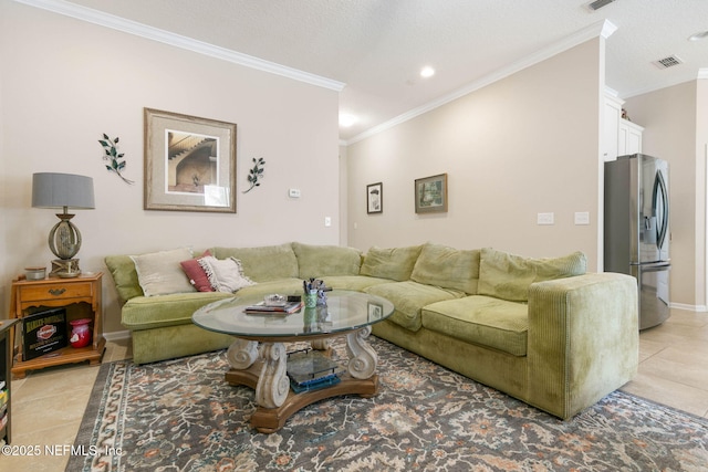 living room featuring light tile patterned floors, a textured ceiling, and ornamental molding