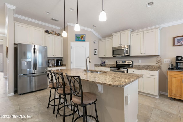 kitchen featuring white cabinets, an island with sink, stainless steel appliances, and sink