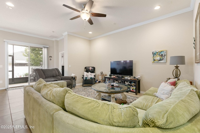 tiled living room with ceiling fan and crown molding