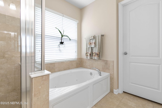 bathroom featuring tile patterned floors and separate shower and tub